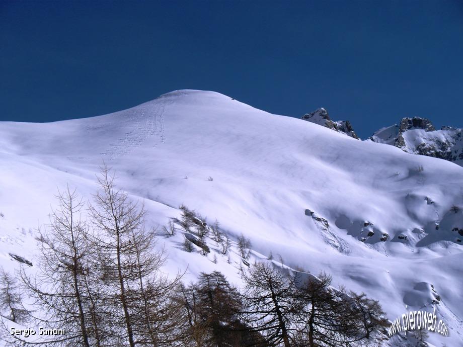 04 Pendii del Barbignada già sciati.JPG - 05 Concarena dal Colombè